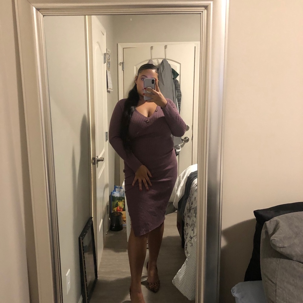 A purple long sleeve bodycon dress